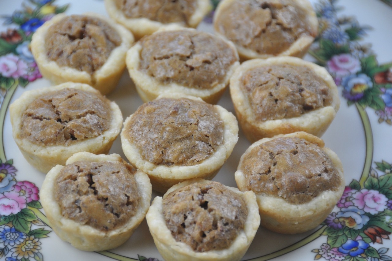 Mini pecan pies with gooey brown sugar and pecan filling in cream cheese pastry. Easy to make.