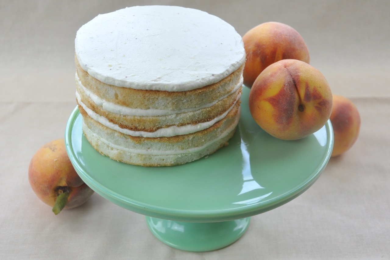 Layers and layers of light and refreshing white cake with luscious lemon cream filling dress up this summer shortcake. Top it off with fresh, ripe peaches.