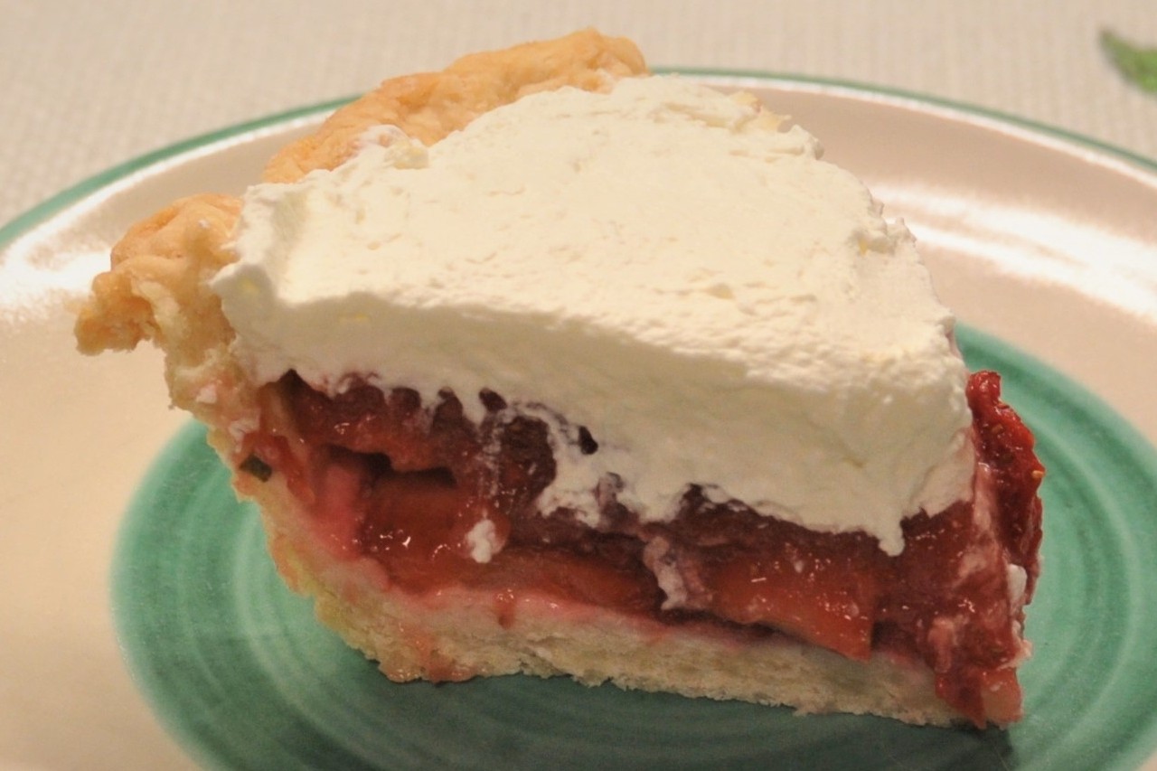 Fresh strawberries blend with cooked strawberries and fresh mint for a luscious summer pie.